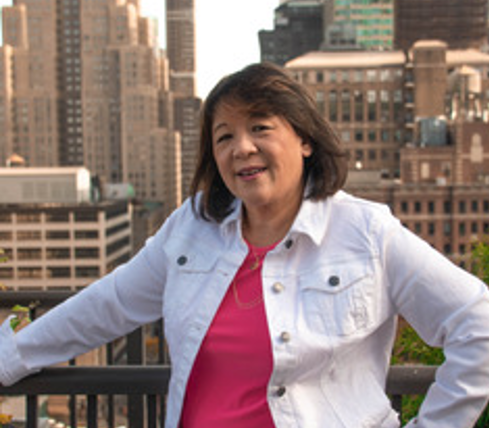 Entrepreneur Esther Tow poses against a city backdrop