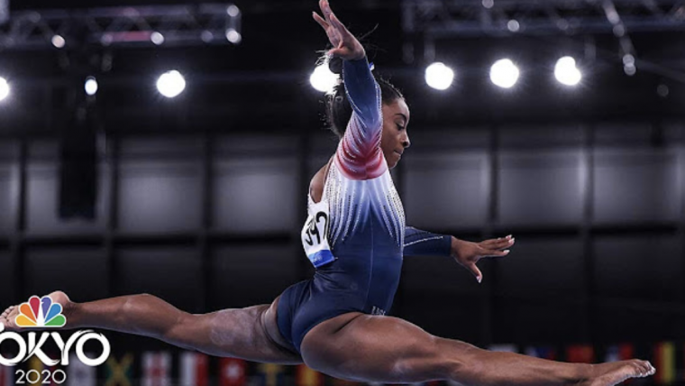 Olympic gymnast Simone Biles jumps into the air