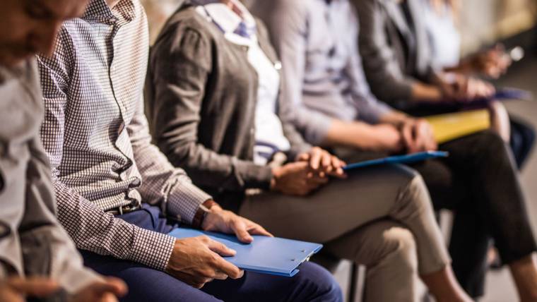 job applicants sit and wait