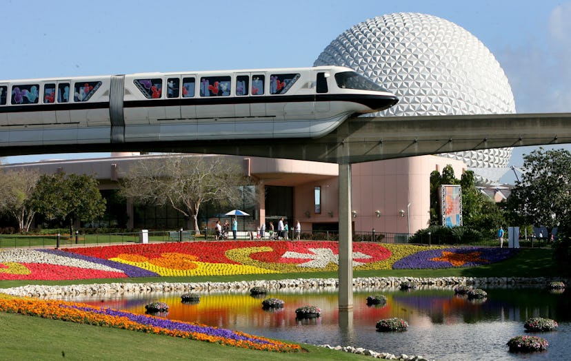 In this March 19, 2009 file photo, a Disney World monorail passes Spaceship Earth at Walt Disney Wor...